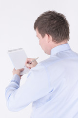 Man writing in a notebook