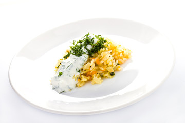 White rice with garlic sauce on a plate  on white background