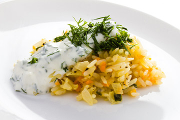 White rice with garlic sauce on a plate  on white background