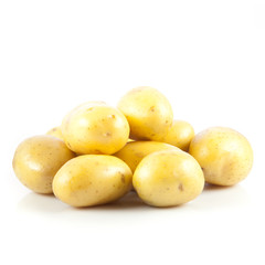 Fresh potatoes on a white background.