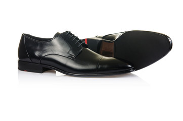 Fashion concept with male shoes on white
