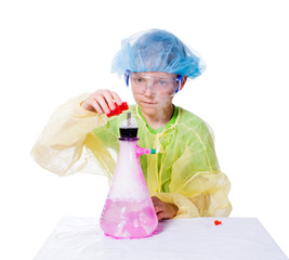 The boy holds the experiments with dry ice and liquid