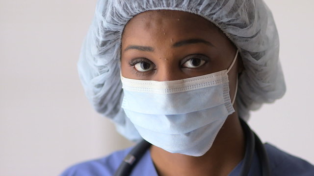 Black woman doctor wearing mask