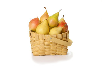 Delicious pears in the basket isolated on white