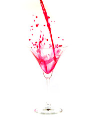 pour the juice into a glass isolated on white background
