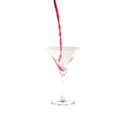 pour the juice into a glass isolated on white background