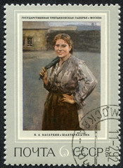 stamp printed in USSR shows a woman-miner