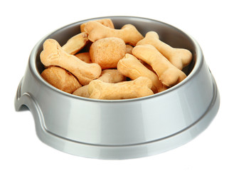 Dry dog treats in bowl isolated on white
