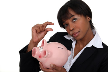 Businesswoman saving for a rainy day