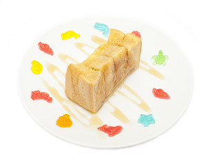 bread topped with honey isolated on white background