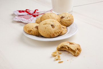delicious apple biscuits on wooden table with heart decorations