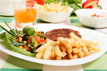 French fries, salad and chop