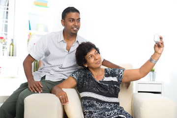 indian family lifestyle photo , son and mother taking self photo
