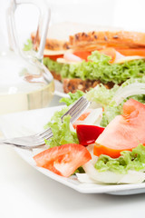 Salad and sandwiches. Selective focus