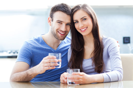 Couple with glasses of water