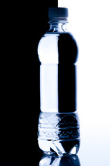 Silhouette of water bottle on black and white background