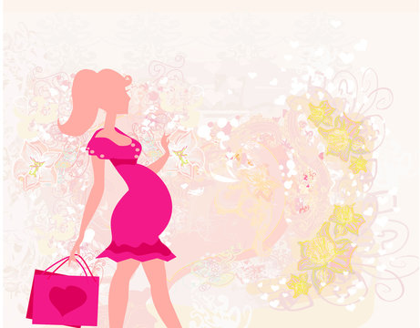 Beautiful pregnant woman on shopping - card