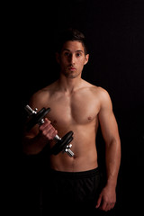 man with dumbbell in hand