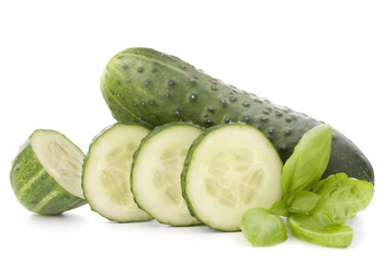 Sliced cucumber vegetable and basil leaves still life