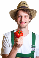 Gärtner präsentiert seine Tomate
