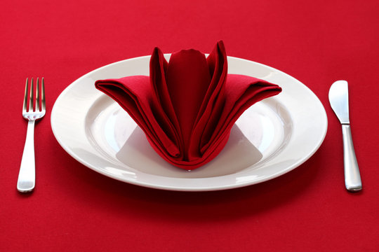 folded napkin like a rose bud, table setting
