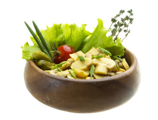 Marinated mushrooms in white saucer isolated on white