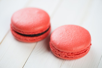 Horizontal shot of two currant flavoured macaroons