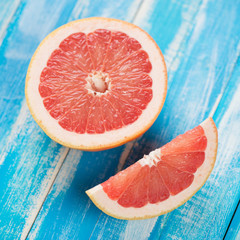 Ripe grapefruit on wooden boards, view from above, studio shot
