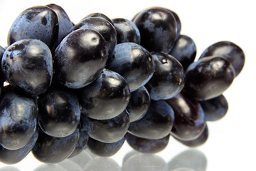 Fresh blue grape fruit on white background
