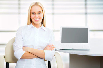 Young business woman using laptop