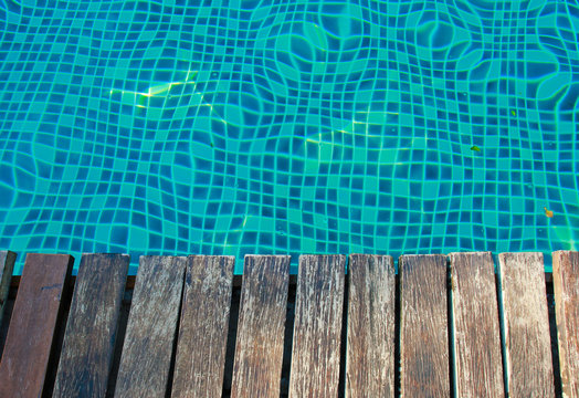 Swimming pool and old wooden deck