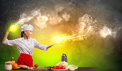 Asian female cooking with magic