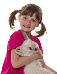 little girl with little goat isolated on white background