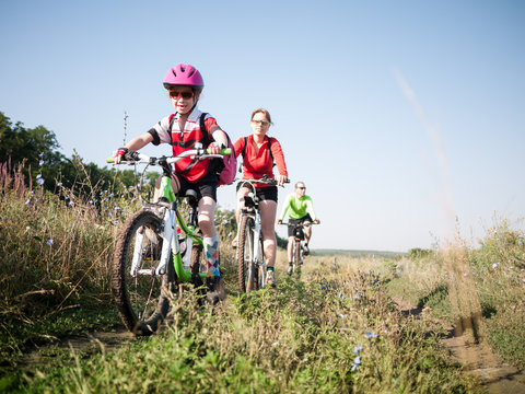 family cycling outdoors