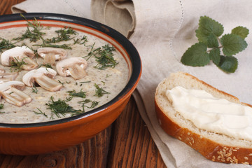Puree soup from champignons and sour cream sandwich