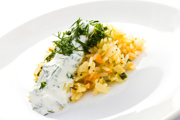 White rice with garlic sauce on a plate  on white background