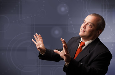 Elegant businessman touching copy space
