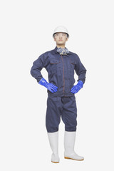 Construction worker posing against white background, portrait