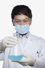Fototapeta premium Scientist Holding Beaker