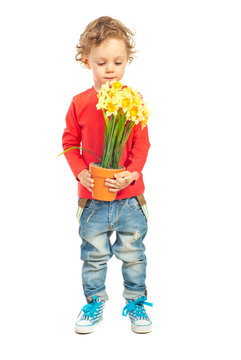 Toddler Boy Smelling Flowers