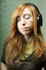 young woman listening to music with closed eyes