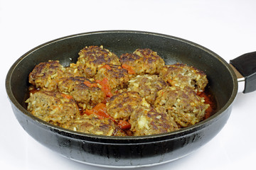 fresh meatballs brger on the frying pan
