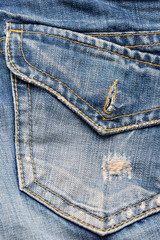 Rear pocket of Blue Denim Jeans