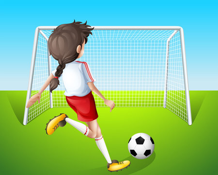 A girl practicing soccer