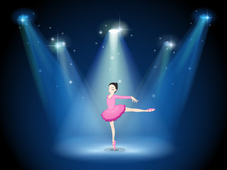 A lady in pink dancing ballet with spotlights