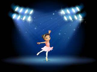 Fototapeta na wymiar A little girl dancing ballet with spotlights