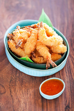 Shrimp tempura with spicy chili sauce, selective focus