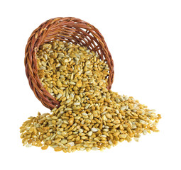 Roasted sunflower kernels spilling from basket
