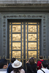 Tourists in front of Golden Door of the Florence Baptistery (Bat