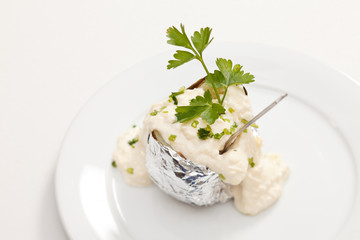 Baked potato with sour cream sauce
